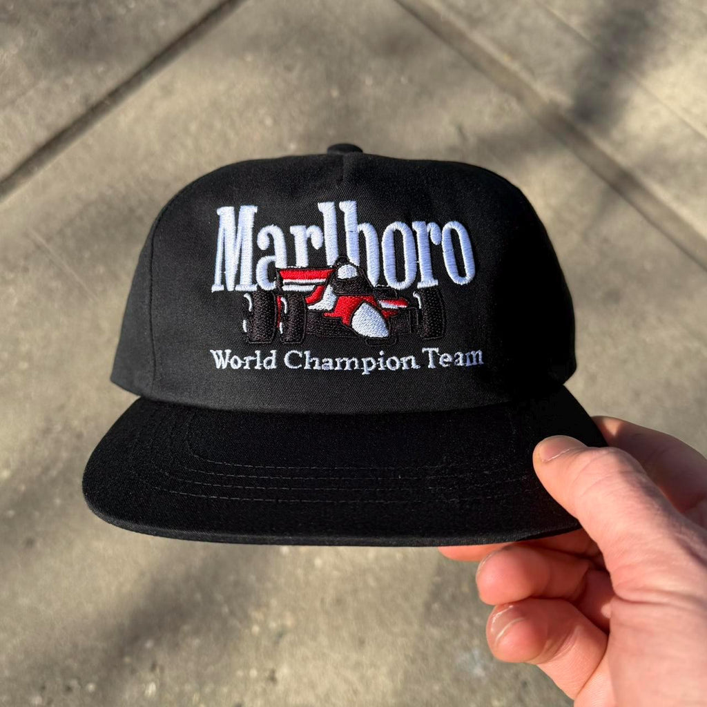 Black Marlboro Racing Snap back on Yupoong blank,