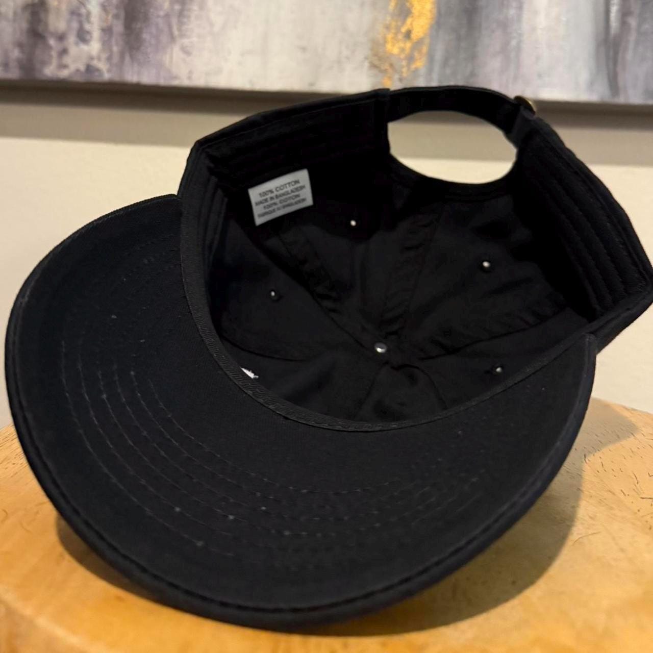 A24 films strap back hat