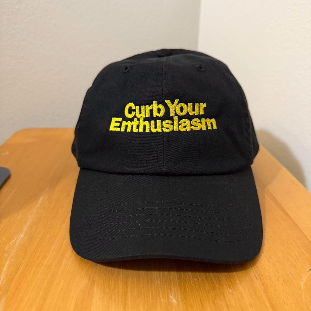 Black and yellow Curb Your Enthusiasm strap back cap