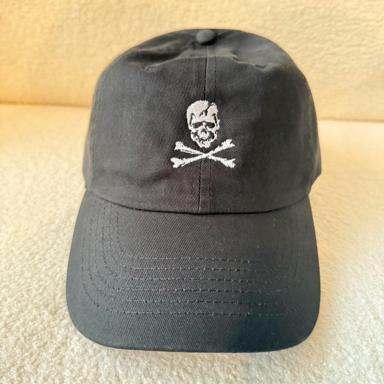 skull and crossbones strap back hat